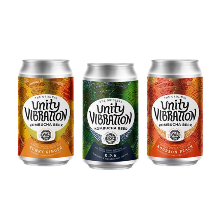 Image of three cans of Unity Vibrations hard kombucha made in Ypsilanti, Michigan.